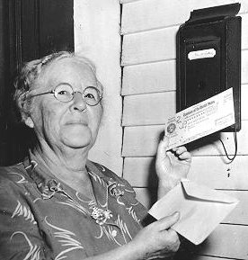 photo of Ida May Fuller receiving a Social Security check
